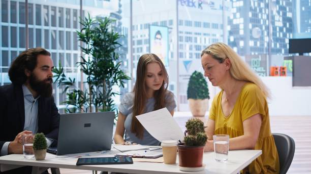 istock Financial adviser assisting clients in setting up investment accounts 2172426264