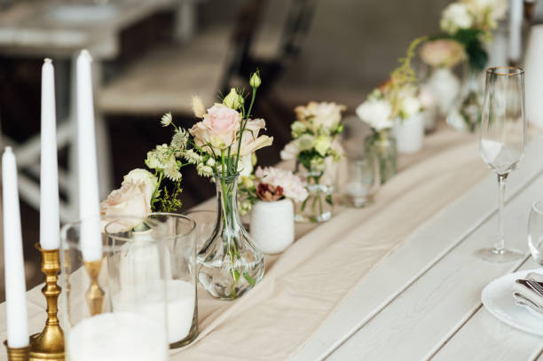 istock Elegant neutral coloured wedding table scape with flowers and candles 2172426524