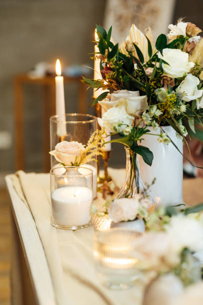 istock Elegant neutral coloured wedding table scape with flowers and candles 2172426800