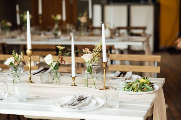 istock Elegant neutral coloured wedding table scape with flowers and candles 2172426873