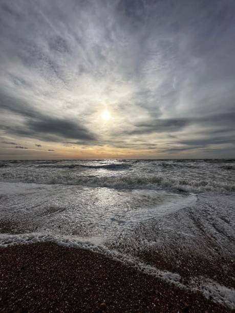 Orange sky above a tranquil winter sea.