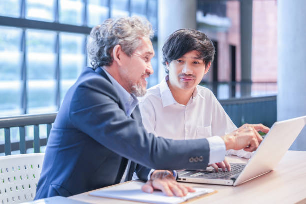 istock A young asian man sitting and conversation with advisor teacher 2172430722