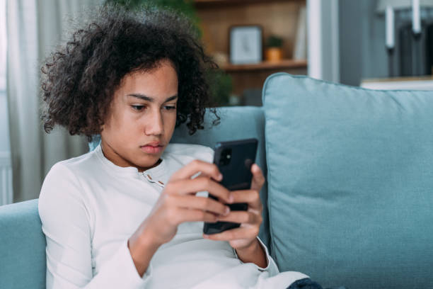 istock Teenager using smartphone at home. 2172434075