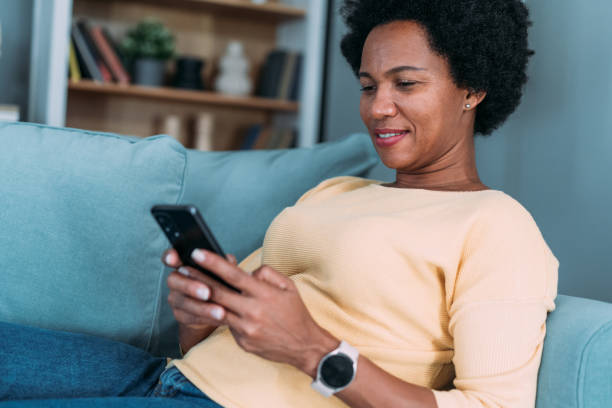 istock Woman using smartphone at home. 2172434078