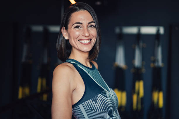 istock Confident young woman working out in a gym. 2172434152