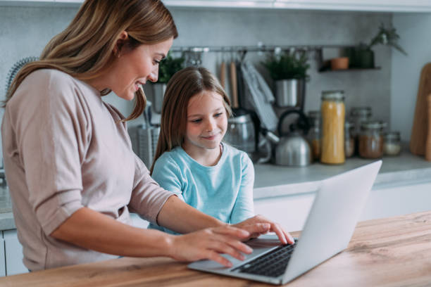 istock Mother and daughter working at home. 2172434262