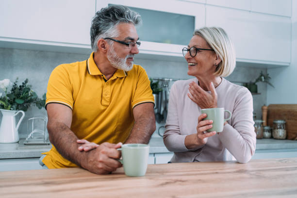 istock Lovely couple drinking coffee at home. 2172435881