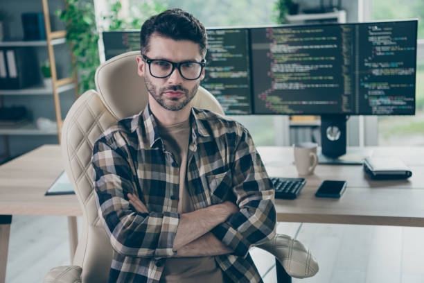 istock Photo of serious focused web designer guy sitting chair crossed arms database optimization workplace open space indoors 2172437243