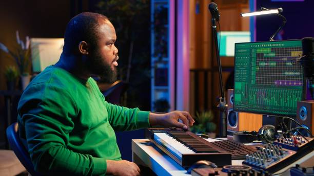 istock Sound engineer recording piano notes with DAW software in his home studio 2172438912