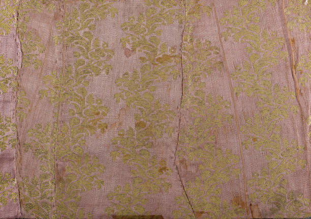 istock Handcrafted with vintage elegance. Maximalism, antique fabric. Traditional Ottoman fabric featuring delicate gold floral motifs on a soft silk background. 2172440840