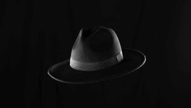 istock classic black fedora hat isolated on black background 2172440894
