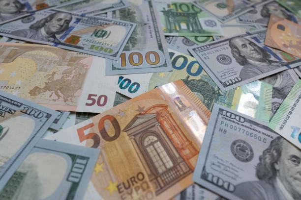 istock US dollar and euro banknotes background 2172445330