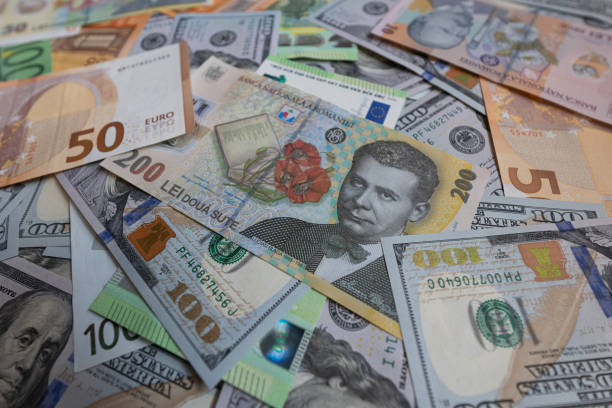 istock US dollar, euro and Romanian lei banknotes background 2172445368