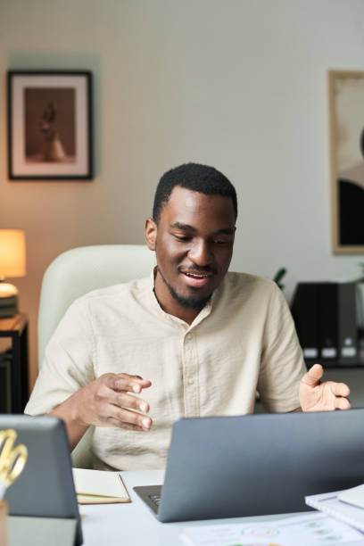 istock Smiling Black Person Working at Desk in Office Setting 2172447721
