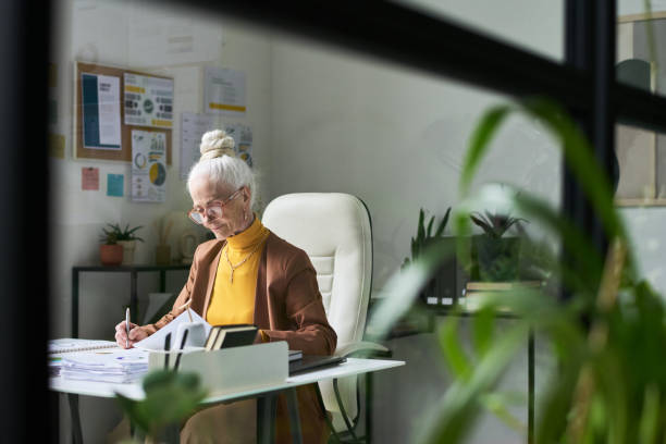 istock Senior Woman Working in Modern Home Office Space 2172447739