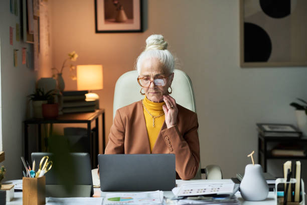 istock Portrait of Elderly Woman Working in Office Setting 2172448418