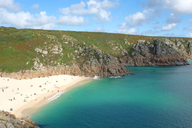 istock Sandy Porthcurno Beach, with Logan Rock headland, West Cornwall, UK. 2172448782