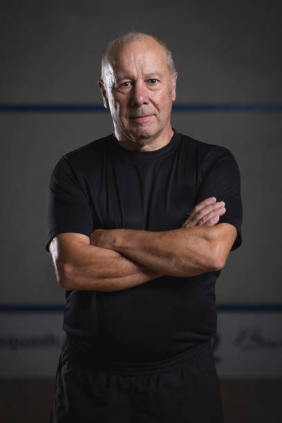 istock Senior Squash Player Posing on Court 2172450298