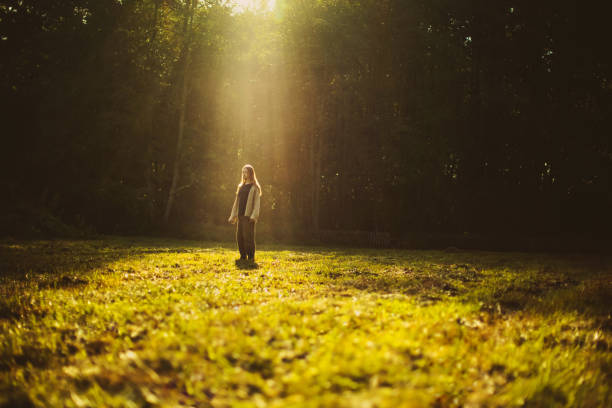 istock Man silhouette in rays of sun. 2172452119