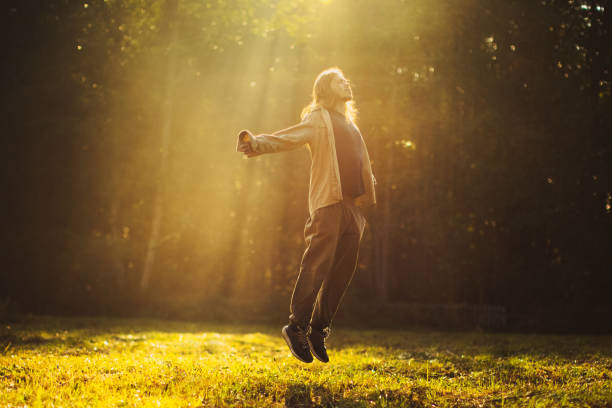 Man silhouette in rays of sun.