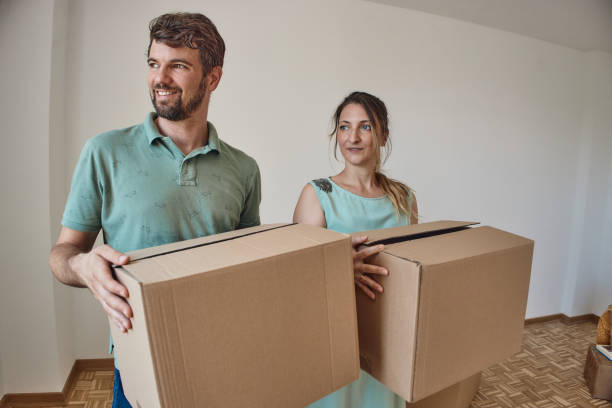 istock Couple moving into new home 2172453581