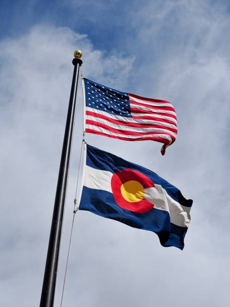 istock United States and Colorado state flags fly from same flagpole 2172458181