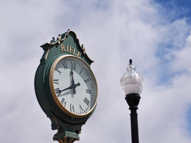 istock Old time clock face in Rifle Colorado with street light 2172458555