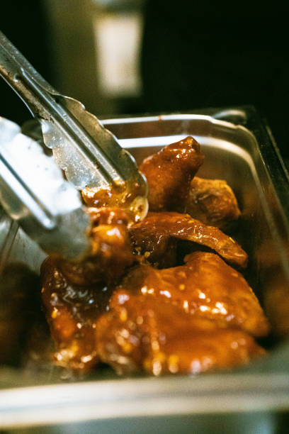 istock Preparing chicken wings in barbecue sos 2172464255