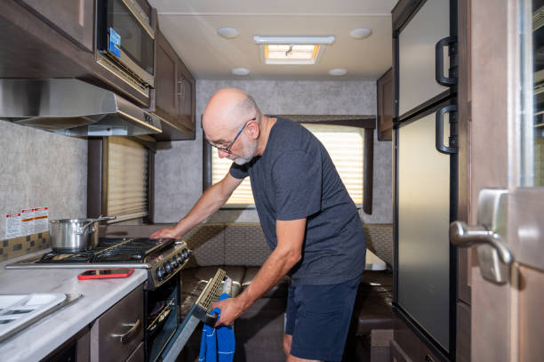 istock Mature man cooking inside motorhome 2172473851