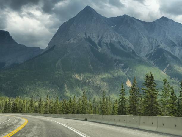istock Dark mountain on winding road 2172476284