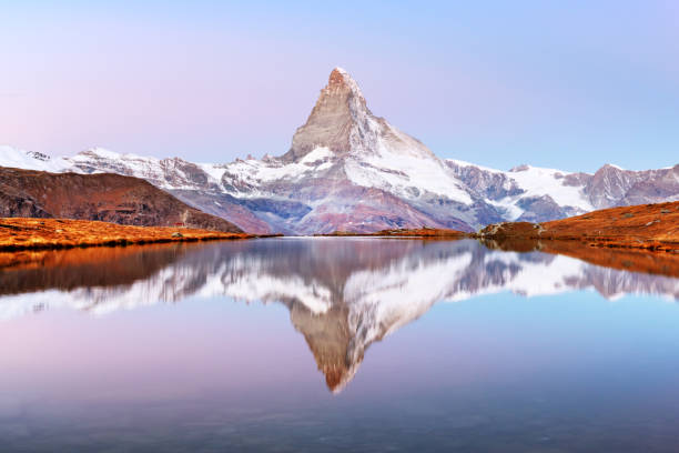 istock Matterhorn peak on Stellisee lake 2172477136