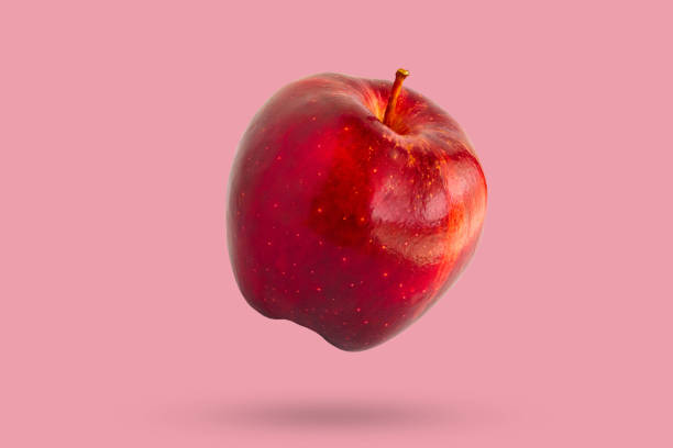 istock Fresh red apple isolated on pink background 2172478891