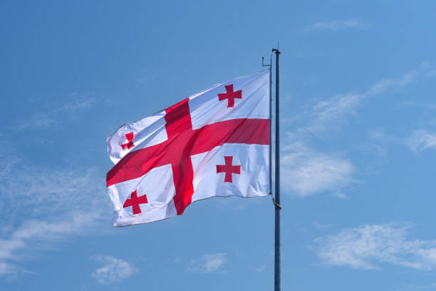 istock Waving Georgian flag under a clear blue sky on a sunny day 2172481742