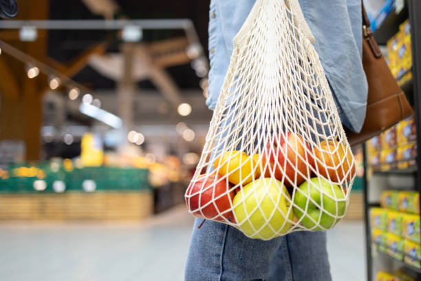 istock Reusable shopping bag filled with fresh fruit in a grocery store 2172483274