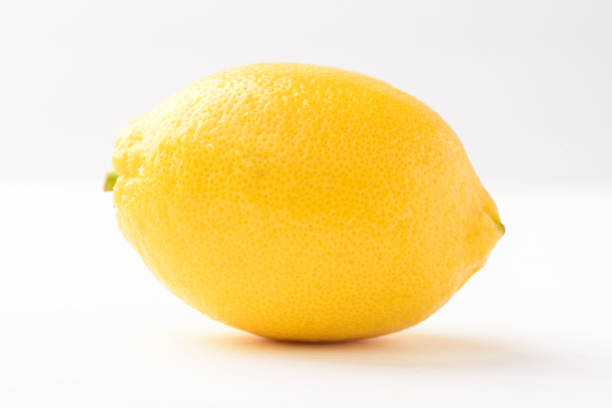 istock Fresh ripe yellow lemon fruit on white background 2172490506
