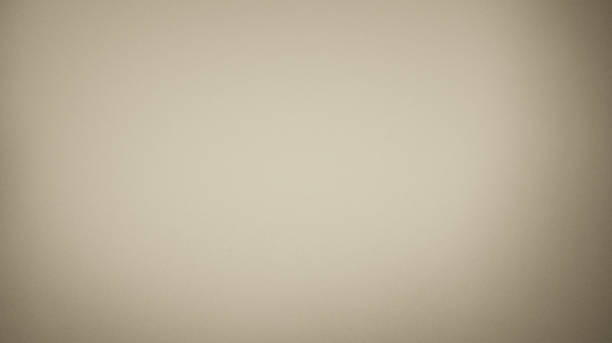 Blurred background, paper texture or fine-grained and smooth sand with a brown gradient. for the backdrop