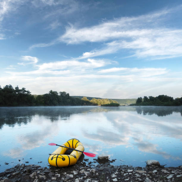 istock Yellow packraft rubber boat with red padle 2172495293