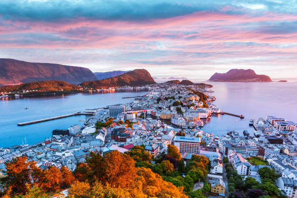 Colorful sunset in Alesund port town Colorful sunset in Alesund port town on western coast of Norway. Place where the ocean meet the mountains. Landscape photography geirangerfjord stock pictures, royalty-free photos & images