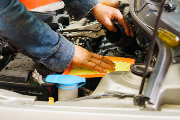 istock A man is working on a car engine, specifically on the air filter 2172514430