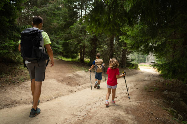 istock Happy family hiking in pine forest 2172514774