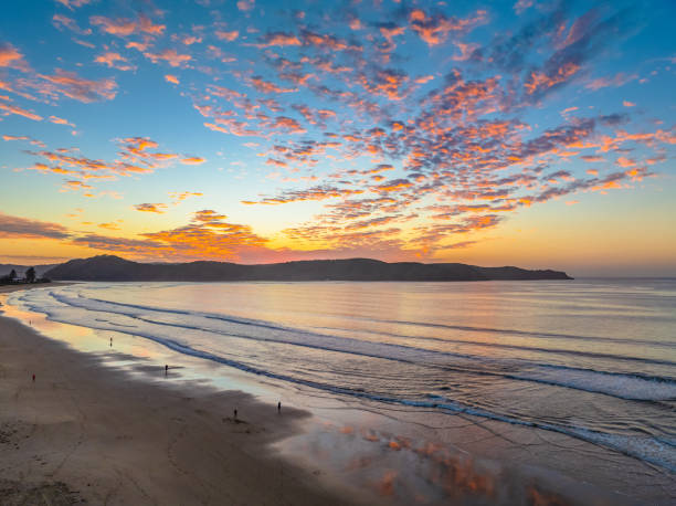 istock Sunrise seascape with pretty clouds in the sky 2172516300