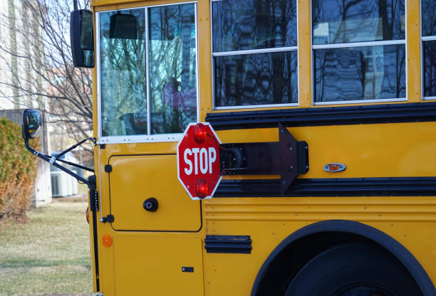 istock Close up on school bus with stop sign 2172516456