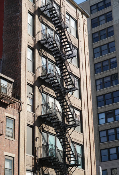 ancient brick building with fire ladder on the wall