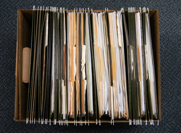 istock high angle view of documents and folders archive in box 2172516902