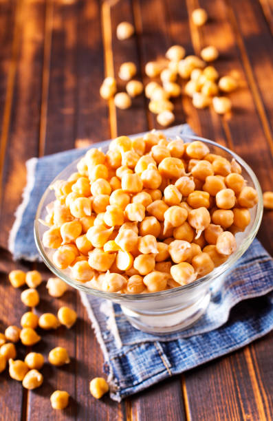 istock Glass bowl filled with boiled chickpeas on a rustic table. 2172522507