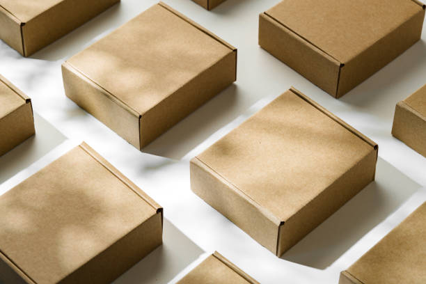 istock Brown cardboard boxes arranged on a light surface for packing goods in a warehouse setting 2172525237