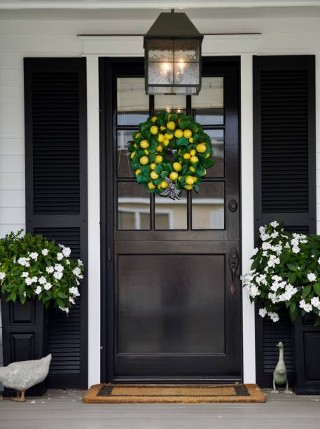 istock Modern farmhouse front door with shutters 2172534311