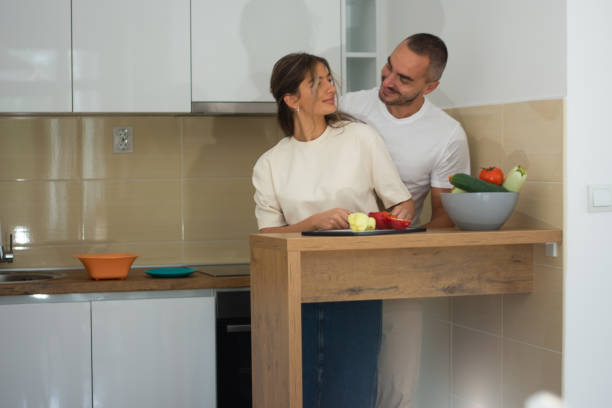 istock Cute joyful couple cooking together 2172534661