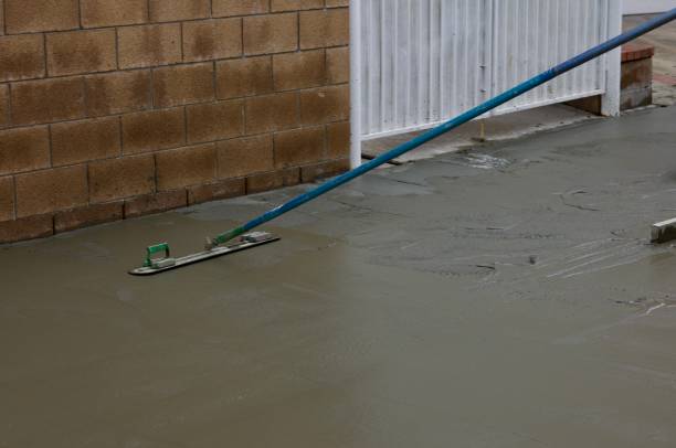 istock Concrete finisher smoothing the wet concrete 2172537083