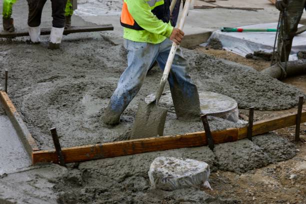 istock Road crew pours fresh concrete on roadway 2172537343